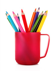 Many colorful pencils in the cup  on the white background
