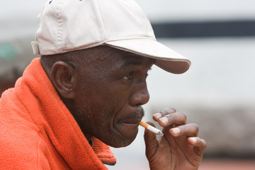 Elderly African American Man Smoking