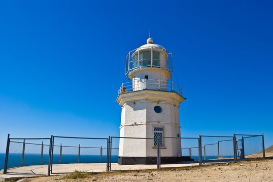 lighthouse on a blue sky background