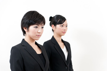 two asian businesswomen standing