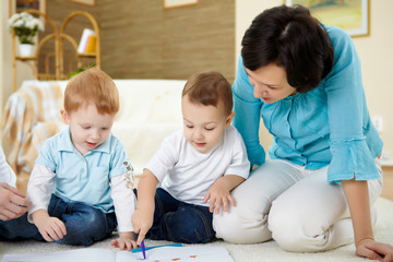 mother and son at home on the floor