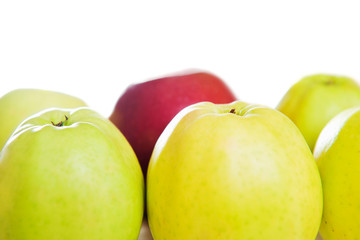 red apple among green