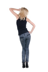 Young woman dancing. Rear view.