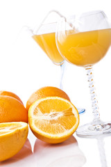Wine glass with orange juice and fruit