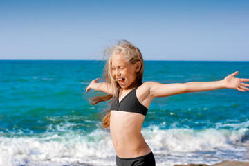 Fototapeta na wymiar Sea portrait girl in sport swimming suit