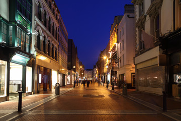 Fototapeta na wymiar Grafton Street South End, shop windows at night in Dublin