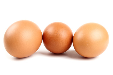 three eggs in a carton