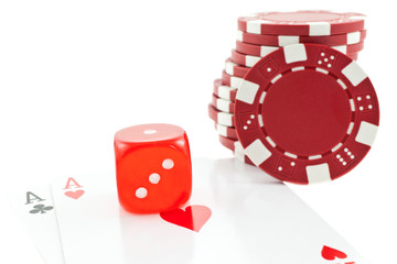 poker chips, cards and red dice cube