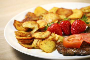 Beef steak with sliced potatoes