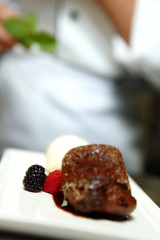 Chef in Restaurant Offers Dessert