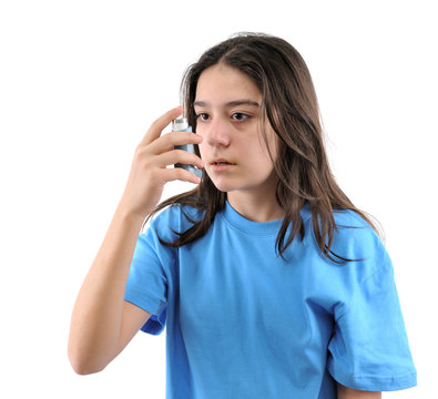 Close Up Image Of A Teenager Using Inhaler For Asthma.