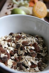 Muesli for breakfast with oatmeal, raisins and fresh fruit