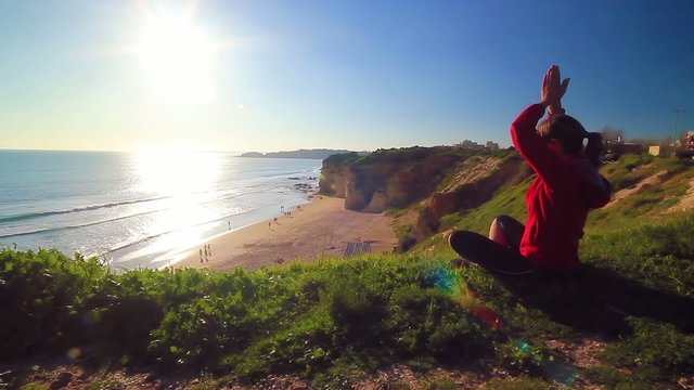 yoga at sunset by the beach