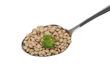Lentil on a spoon, isolated on white