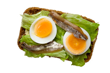 Open sandwich with egg and anchovy, upper view