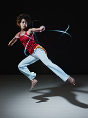 Fototapeta na wymiar hispanic woman playing capoeira martial art