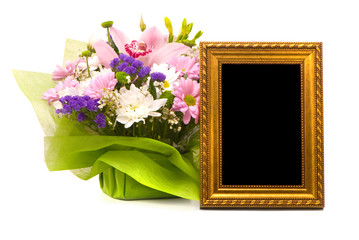 Beautiful bouquet and golden frame on a white