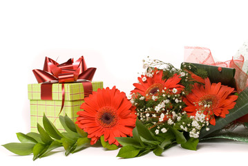 Magnificent bouquet gerbera and present box on a white