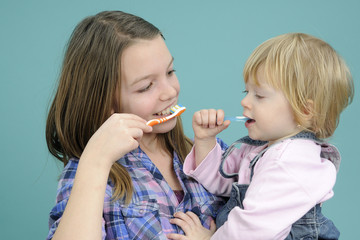 white children washing teeth