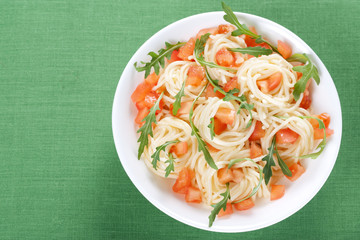 Pasta with tomato and rucola