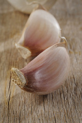 raw garlic on wood background