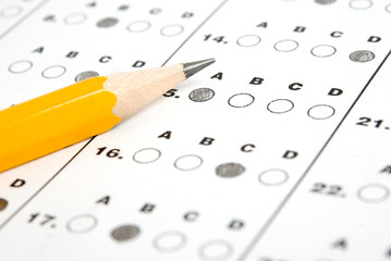 Close up of pencil on answer sheet - test.