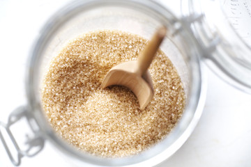 Brown sugar in a glass jar,selective focus