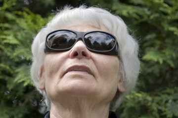 Senior woman dark glasses