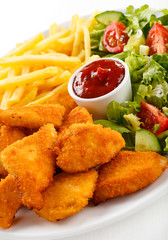 Fried chicken nuggets, French fries and vegetables