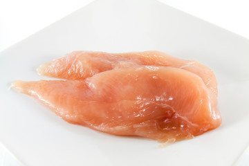 raw chicken on white background