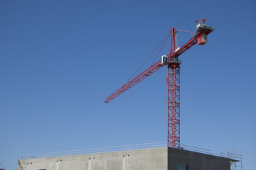 Construction crane above a new structure
