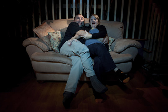 Couple Watching Scary Movie On TV