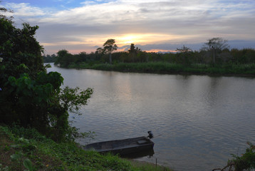 Fototapeta premium Motorboat and Sunset