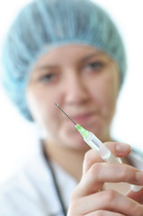Nurse with a syringe on white background