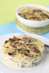 Mushroom gratin with eggs and cheese, garnished with parsley