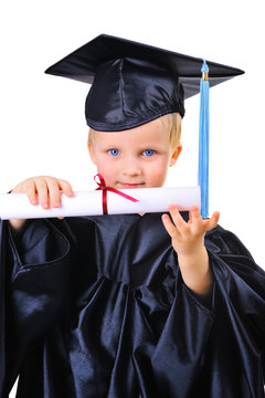 Cute Little Boy In Graduation Gown Receiving Diploma