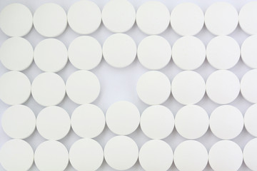 pattern of white tablets with one missing out
