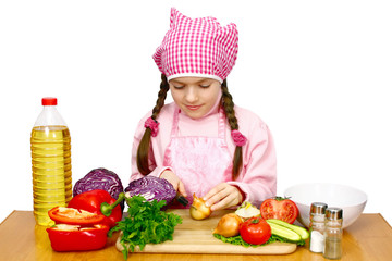 girl preparing salad from vegetables