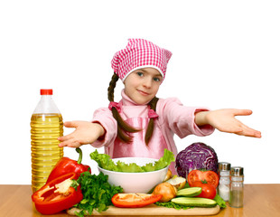 girl preparing salad from vegetables