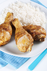 Roasted chicken legs with boiled rice