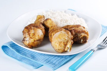 Roasted chicken legs with boiled rice