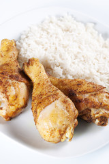 Roasted chicken legs with boiled rice