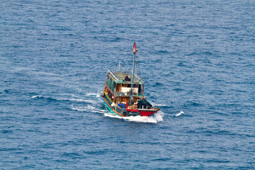 A ferry boat is carrying people to the places of interest