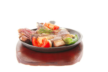 beef meat steak on metal iron plate