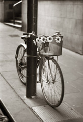 Fototapeta na wymiar Bicycle chained to pole