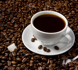 cup of coffee on beans