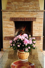 flowers in front of a fireplace