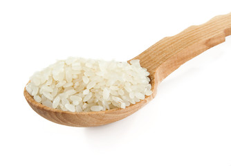 rice in wooden spoon isolated on white