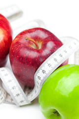 apple and measure tape isolated on white