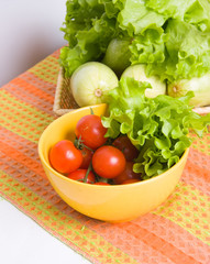 bowl with tomatoes and lettuce